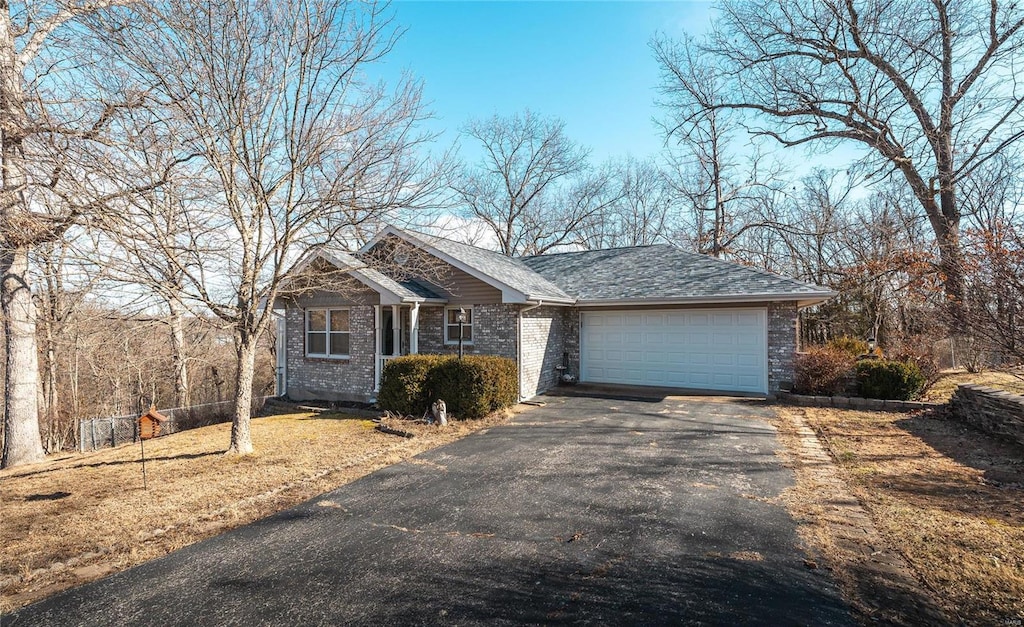 ranch-style house featuring a garage