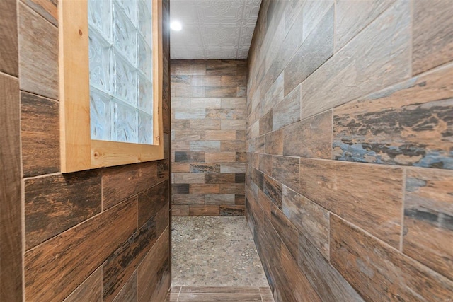 interior space featuring tiled shower