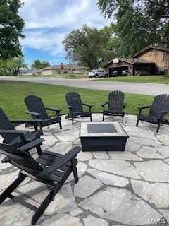 view of patio featuring an outdoor fire pit