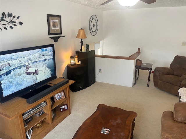 carpeted living room featuring a textured ceiling and ceiling fan