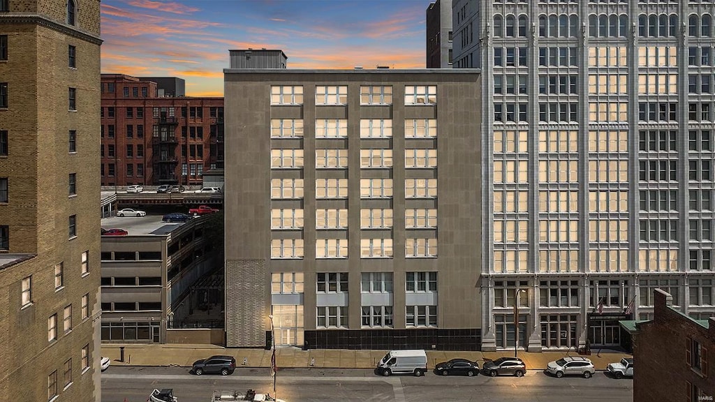 view of outdoor building at dusk