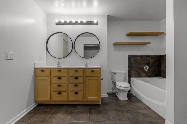 bathroom with toilet, a bathtub, and vanity