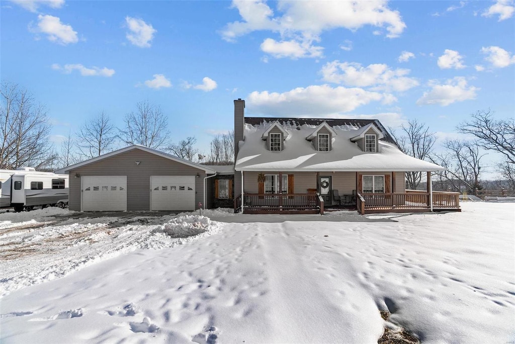 view of front of home featuring covered porch and a garage