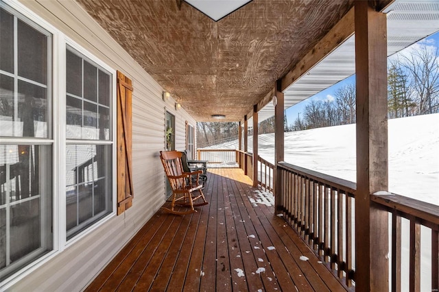 view of snow covered deck