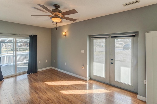 entryway with french doors, ceiling fan, and light hardwood / wood-style flooring