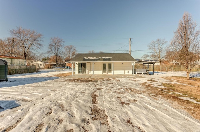 rear view of property with french doors