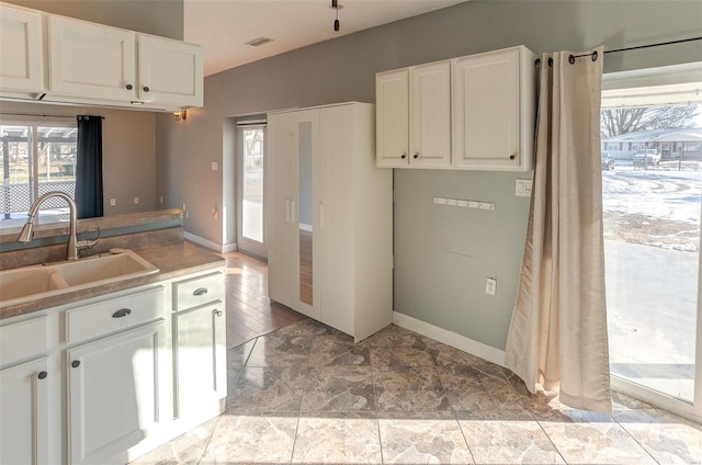 kitchen with sink and white cabinets