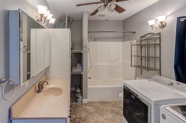 full bathroom with washing machine and clothes dryer, toilet, shower / bathtub combination, vanity, and ceiling fan