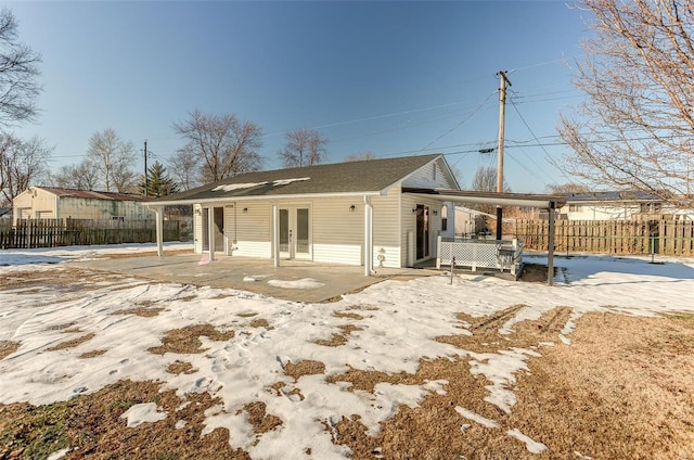 back of house featuring french doors