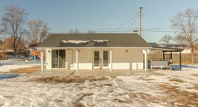 rear view of house featuring french doors