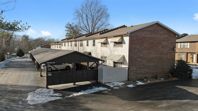 view of home's exterior with a carport