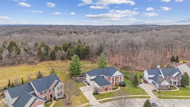 aerial view featuring a wooded view