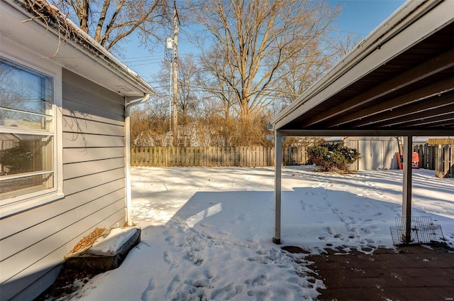 view of yard covered in snow