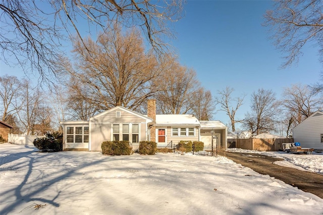 view of front of home with a sunroom