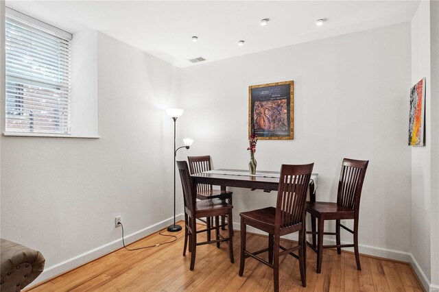 dining room with hardwood / wood-style flooring