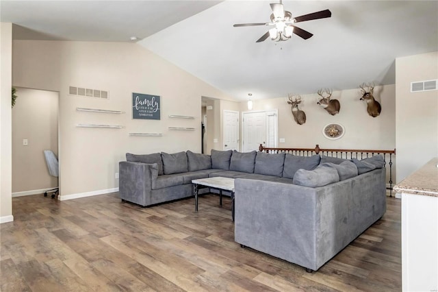 living room featuring a ceiling fan, visible vents, vaulted ceiling, and dark wood-type flooring