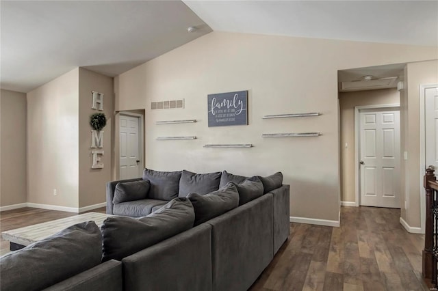 living room featuring vaulted ceiling, dark wood-type flooring, visible vents, and baseboards