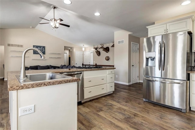 kitchen with visible vents, dark wood-style floors, appliances with stainless steel finishes, open floor plan, and a sink