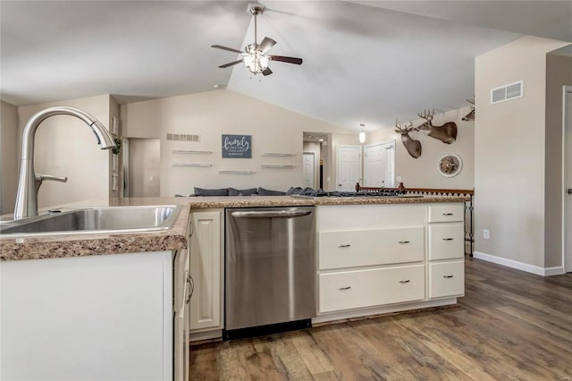 kitchen with appliances with stainless steel finishes, visible vents, a sink, and wood finished floors