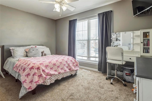 bedroom featuring a ceiling fan, carpet, visible vents, and baseboards