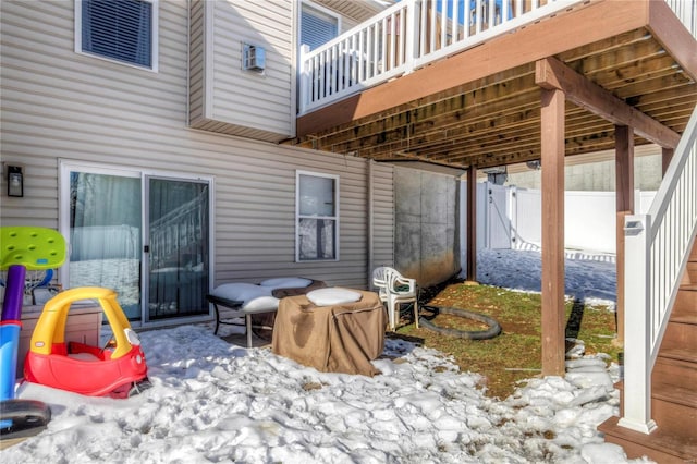 view of patio / terrace featuring fence and a wall mounted AC