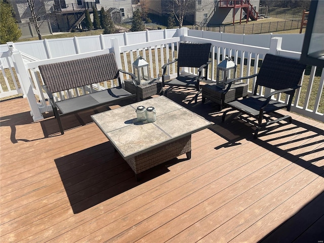 deck with fence and an outdoor hangout area