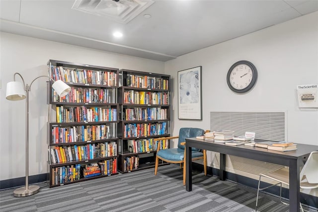 office area featuring visible vents, baseboards, and carpet