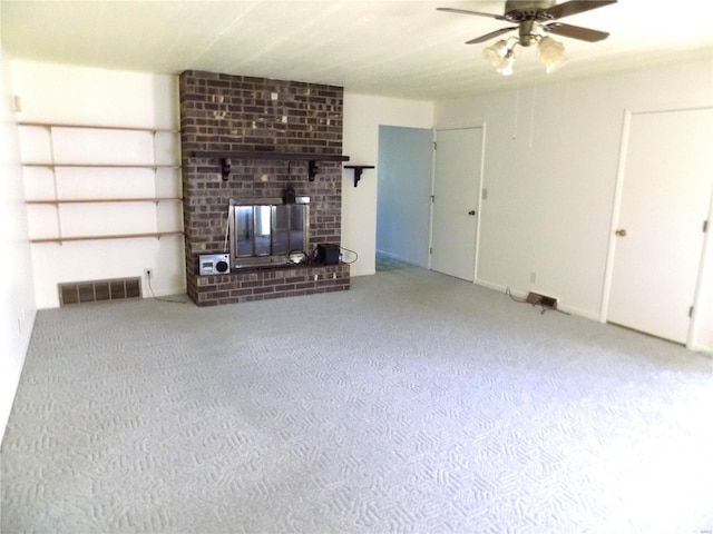 unfurnished living room with carpet flooring, a fireplace, and ceiling fan