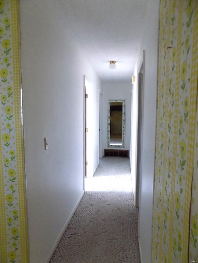 corridor with carpet flooring