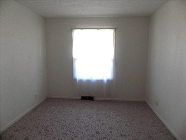 empty room with light colored carpet