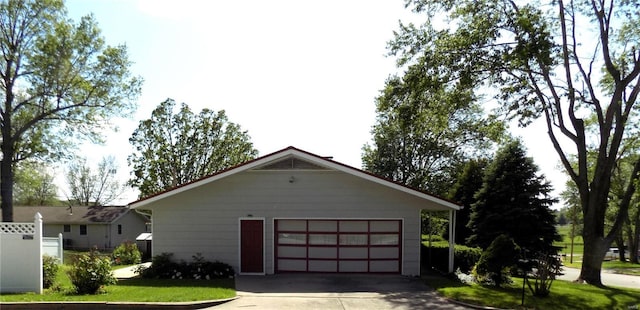 view of side of property with a garage