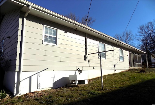 view of property exterior featuring a yard