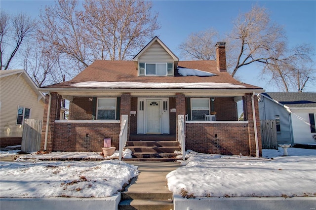 view of front of property featuring covered porch