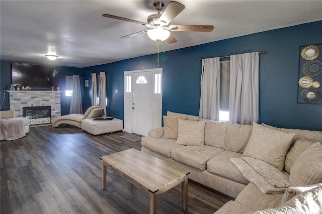 living room featuring ceiling fan and wood-type flooring