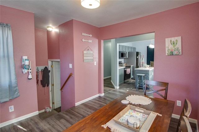 dining area with hardwood / wood-style floors