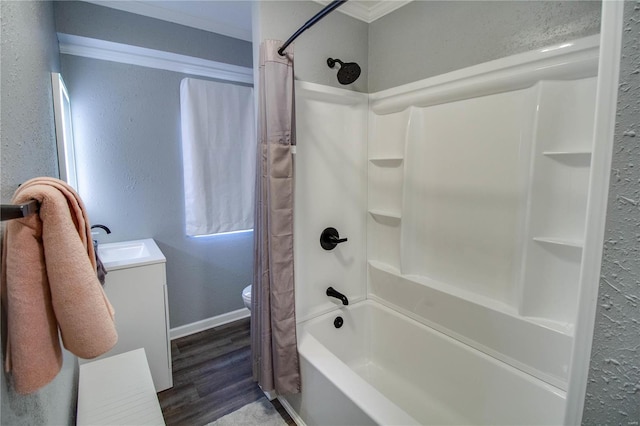 full bathroom featuring toilet, vanity, shower / bath combo, crown molding, and hardwood / wood-style flooring