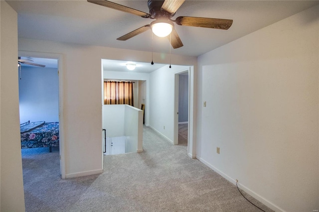 spare room with light colored carpet