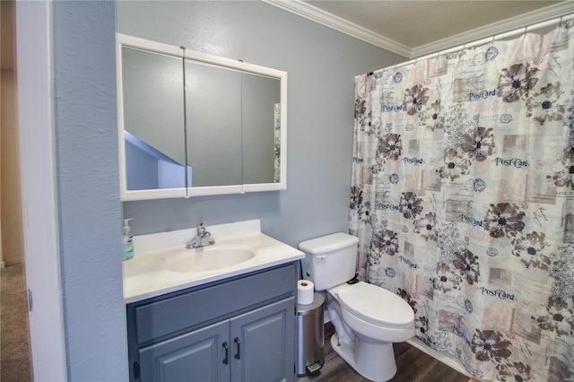 bathroom with curtained shower, vanity, toilet, hardwood / wood-style flooring, and crown molding