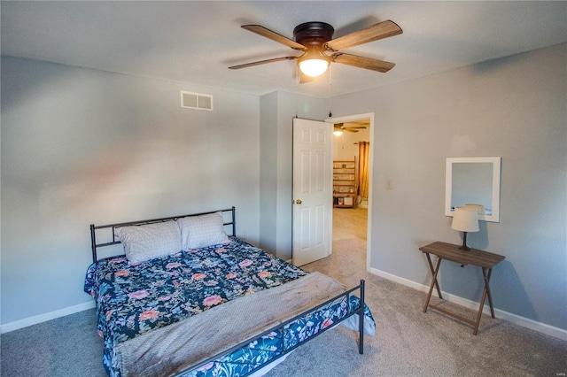 bedroom with ceiling fan and carpet floors