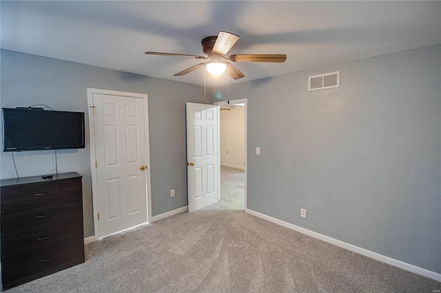 unfurnished bedroom featuring ceiling fan and light colored carpet