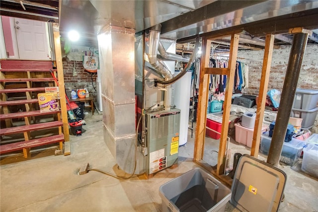 utility room featuring heating unit