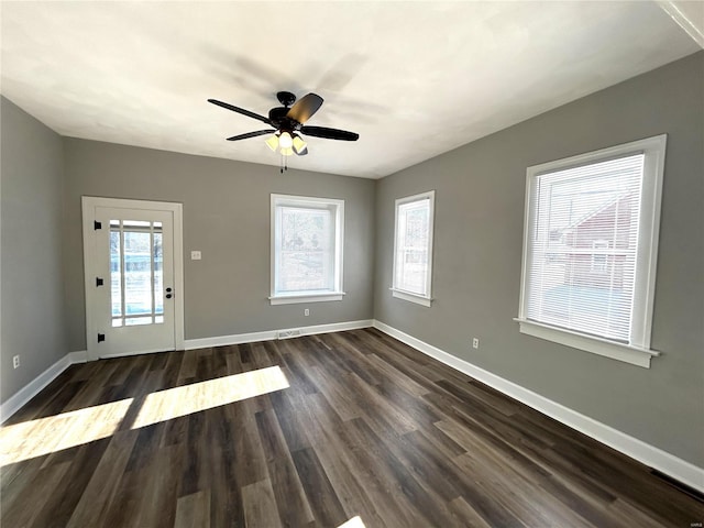 interior space featuring ceiling fan and dark wood-type flooring