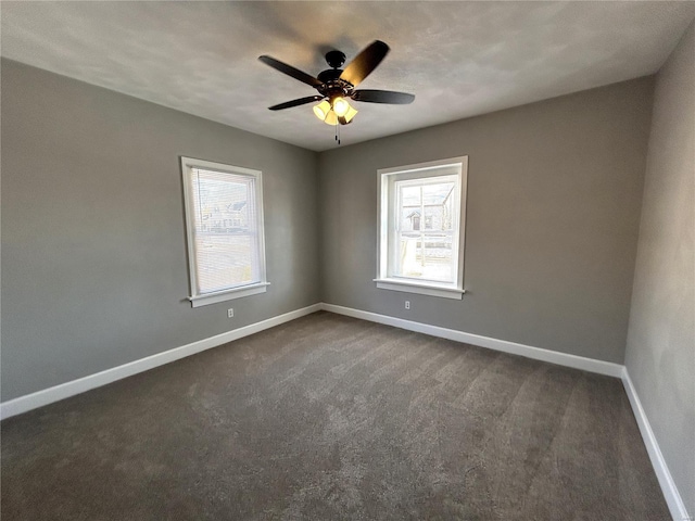 unfurnished room featuring ceiling fan and dark carpet