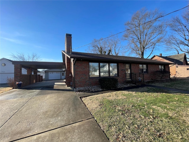 ranch-style home with a carport, a garage, and a front yard