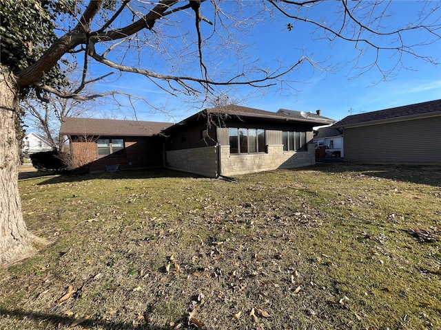 view of side of property with a yard