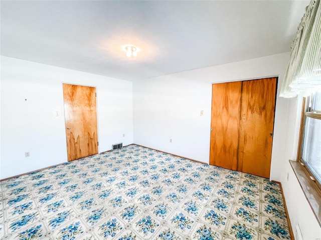 unfurnished bedroom featuring a closet