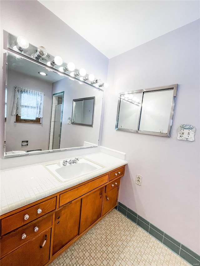 bathroom featuring vanity and tile patterned flooring