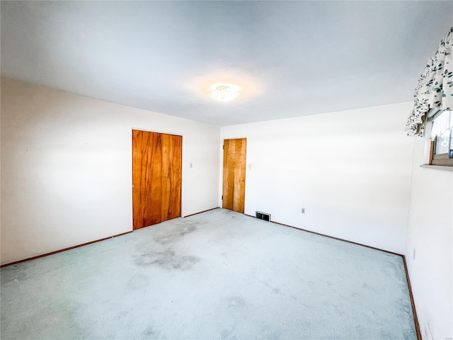 empty room featuring carpet flooring