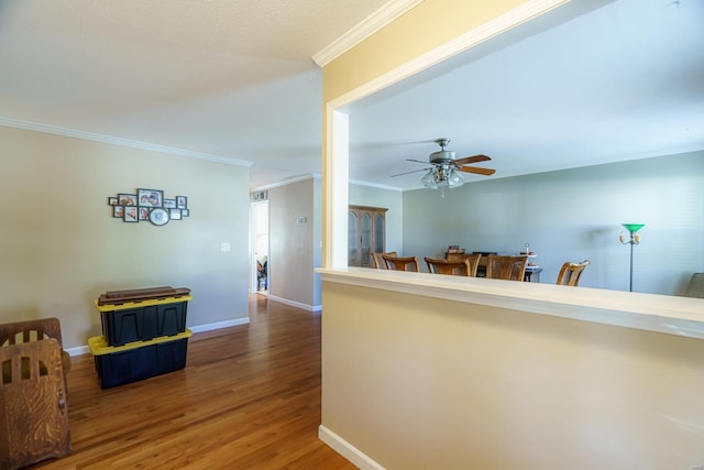 corridor featuring ornamental molding and hardwood / wood-style floors