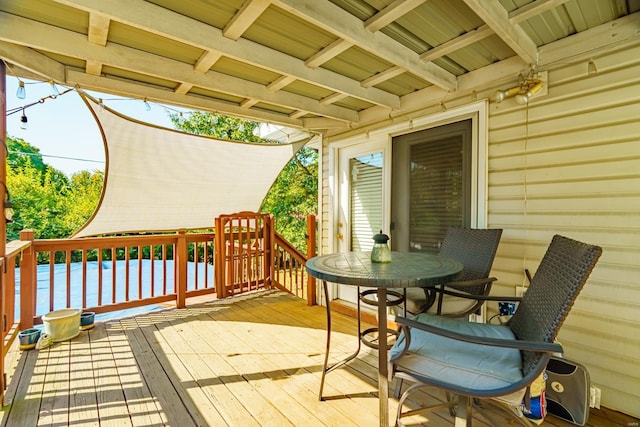 wooden deck with a water view